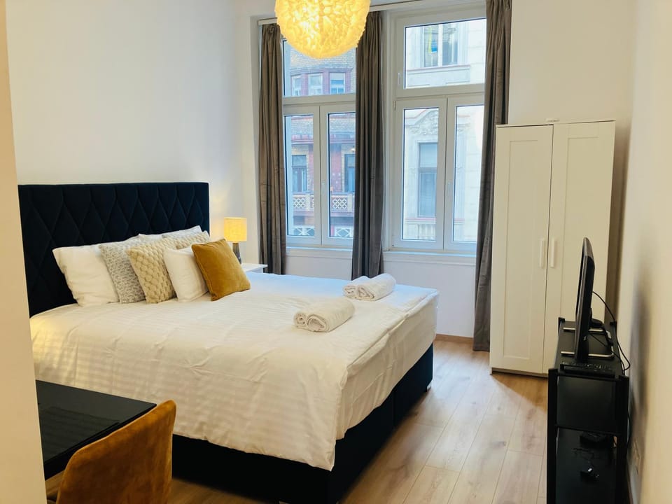Bed, TV and multimedia, Bedroom, towels, wardrobe
