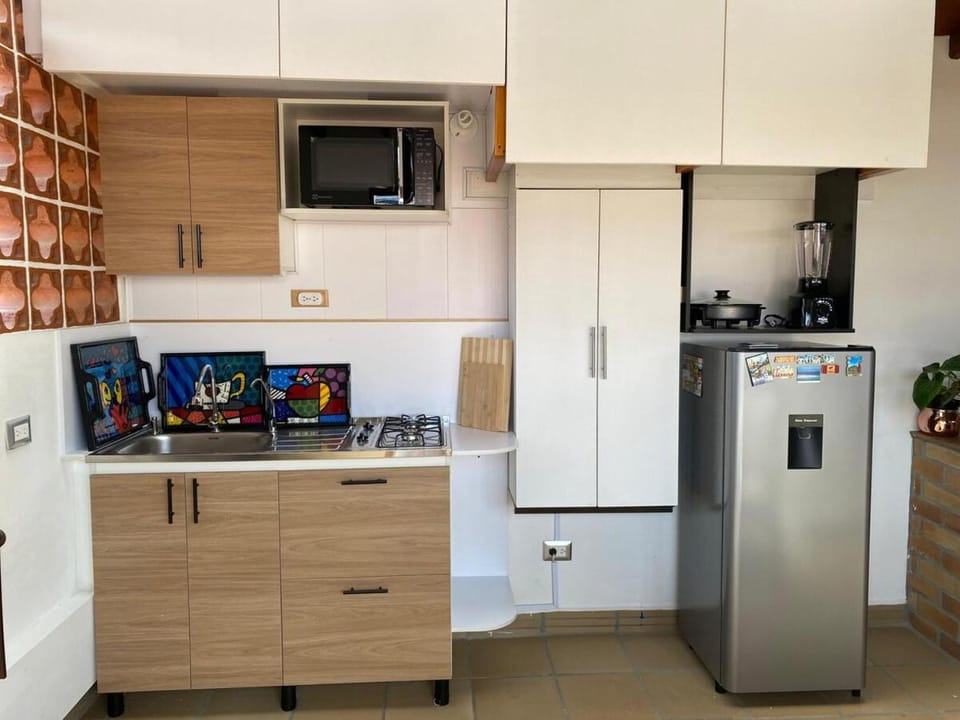 Kitchen or kitchenette, dishwasher, oven, stove, toaster