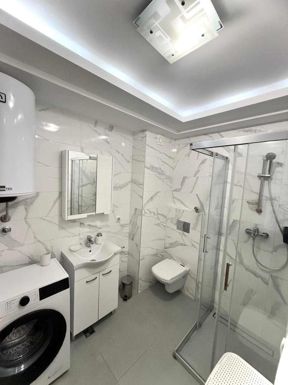 Shower, Toilet, Bathroom, towels, washing machine, dryer