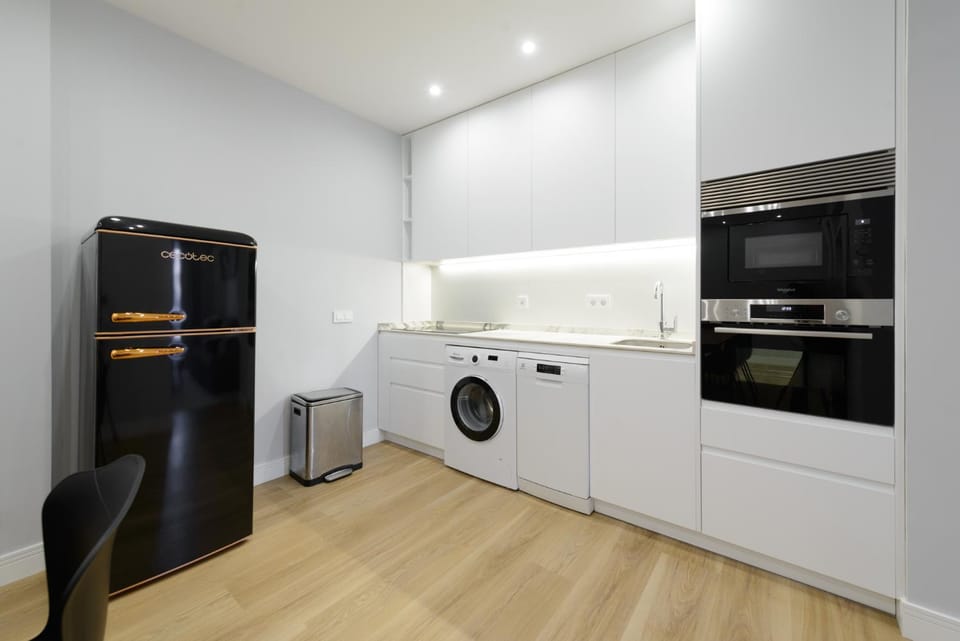 Kitchen or kitchenette, dishwasher, oven, stove, toaster, washing machine, dryer