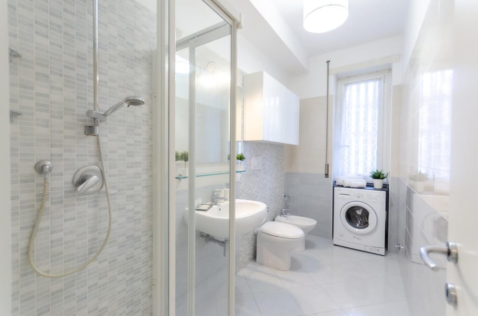 Shower, Toilet, Bathroom, bidet, towels, washing machine