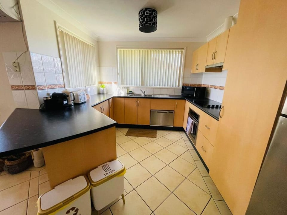 Kitchen or kitchenette, dishwasher, oven, stove, toaster
