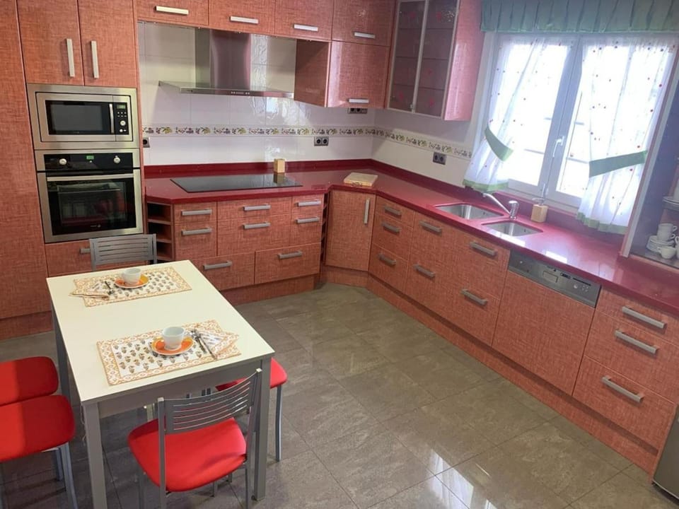Kitchen or kitchenette, dishwasher, oven, stove, toaster