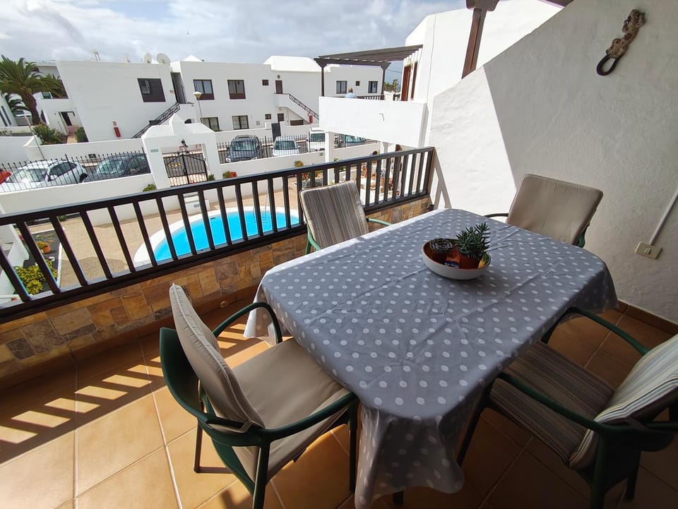 View (from property/room), Balcony/Terrace, Seating area, Dining area, Pool view, Swimming pool