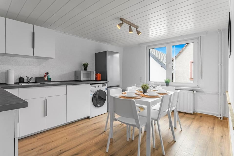 Kitchen or kitchenette, Dining area, dishwasher, stove, washing machine