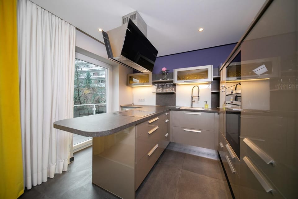 Kitchen or kitchenette, dishwasher, oven, stove