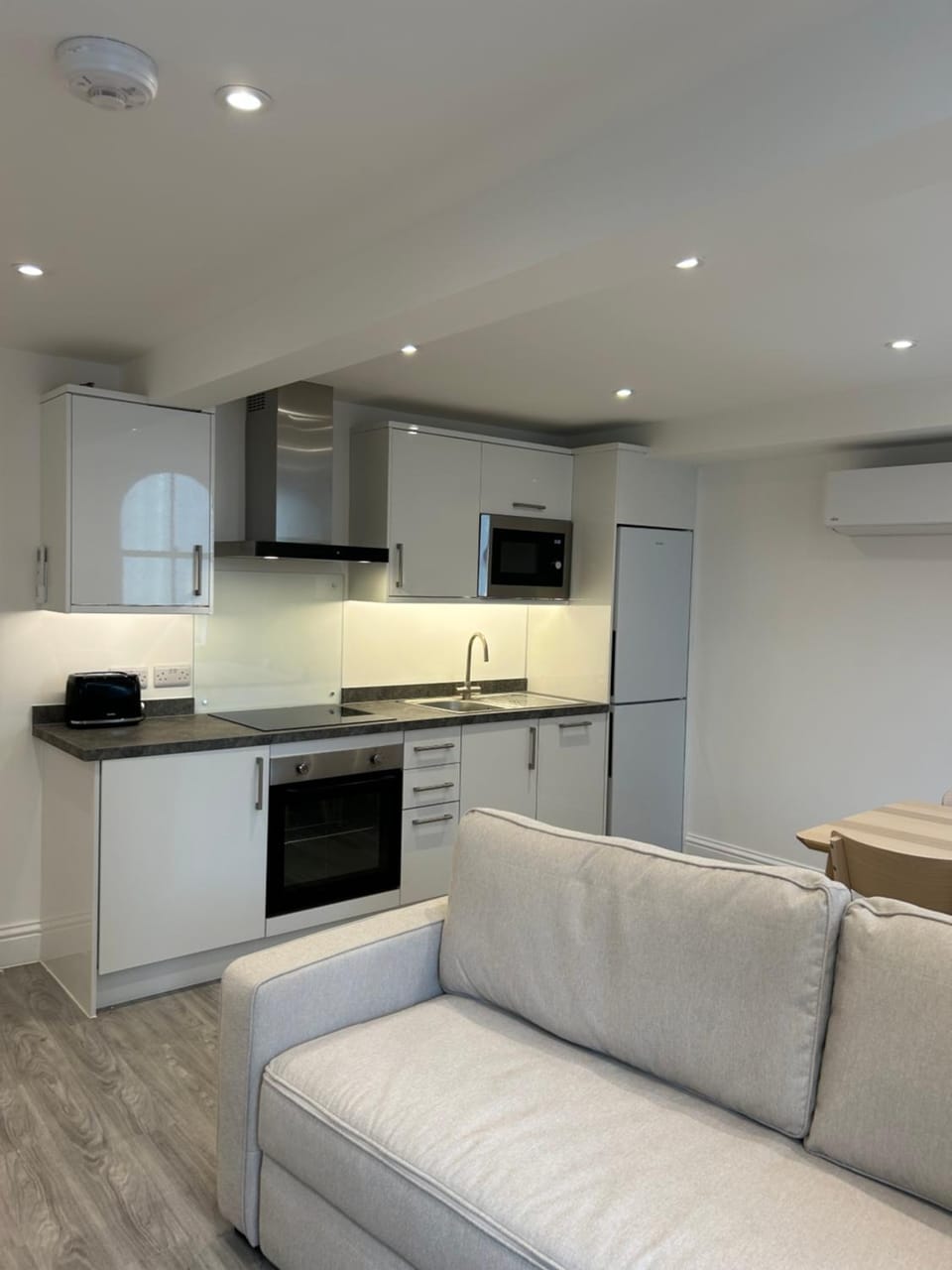 Kitchen or kitchenette, dishwasher, oven, stove