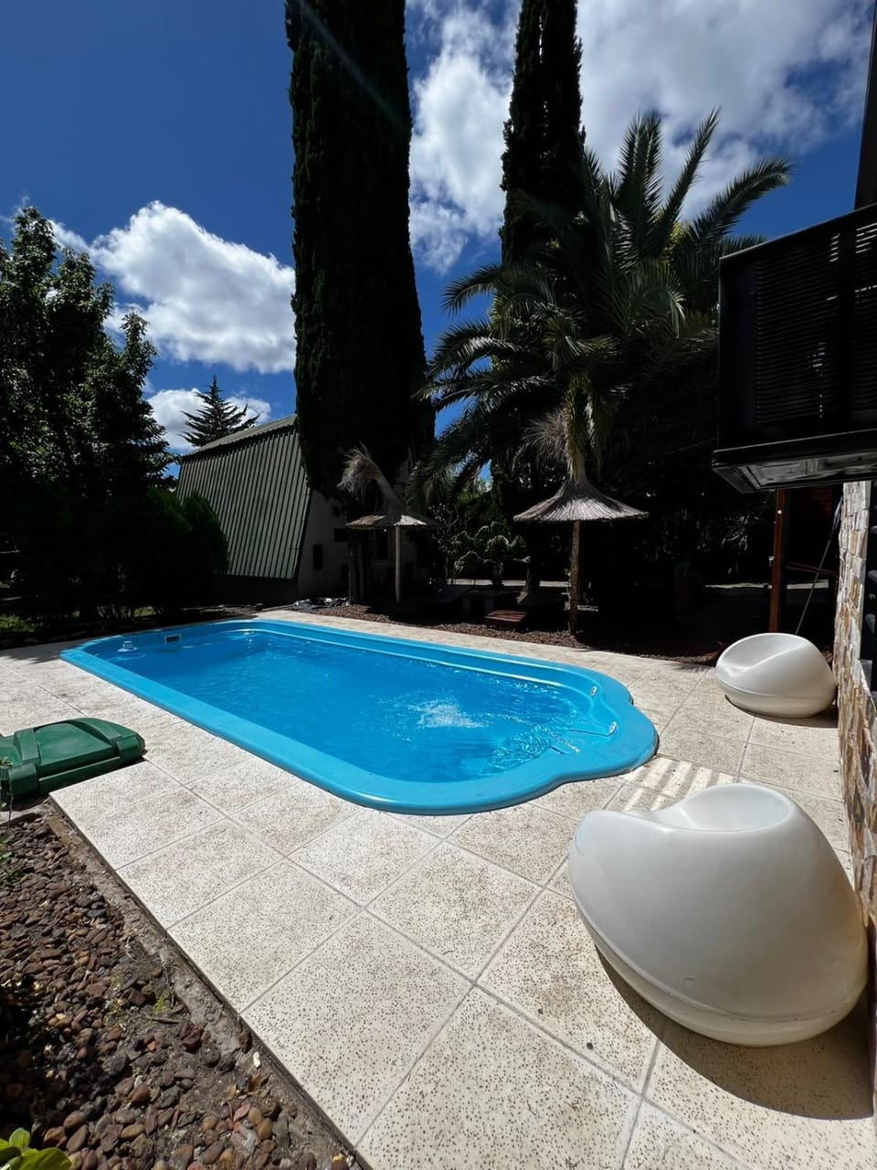 Patio, Day, Natural landscape, Pool view, Swimming pool, sunbed