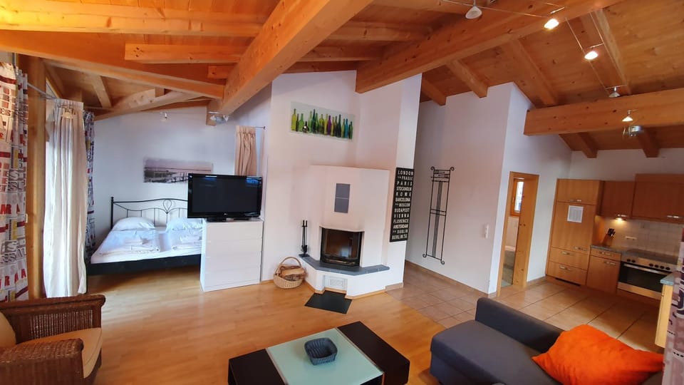 Bed, TV and multimedia, Living room, Seating area, flat iron