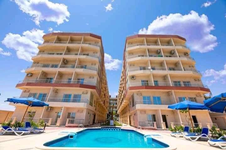 Property building, Pool view, Swimming pool, sunbed