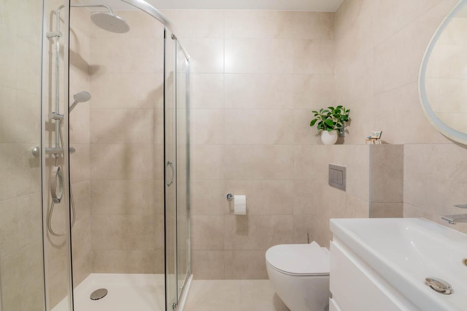 Shower, Toilet, Bathroom, flat iron, hair dryier, towels