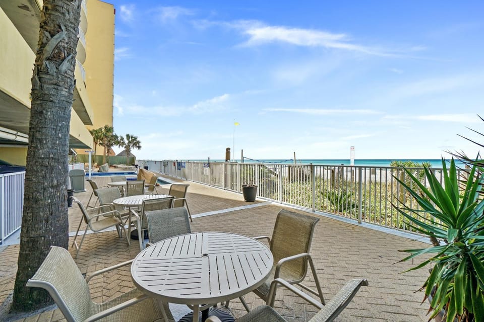 Property building, People, People, People, Natural landscape, View (from property/room), Balcony/Terrace, Seating area, Beach, Guests, Guests, Guests, Sea view, Area and facilities, children, children, children, young children, young children, young children, older children, older children, older children, group of guests, group of guests, group of guests, Family, Family, Family