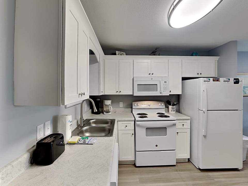 Kitchen or kitchenette, microwave, oven, stove, kitchen