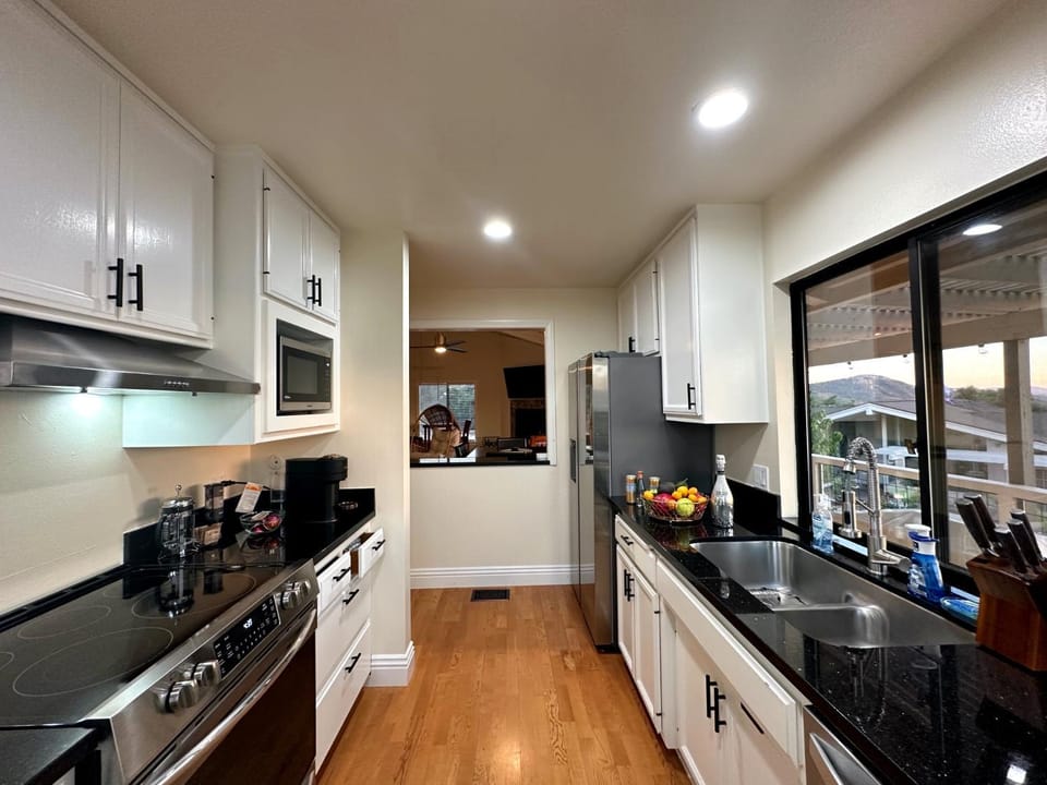 Kitchen or kitchenette, dishwasher, stove, toaster