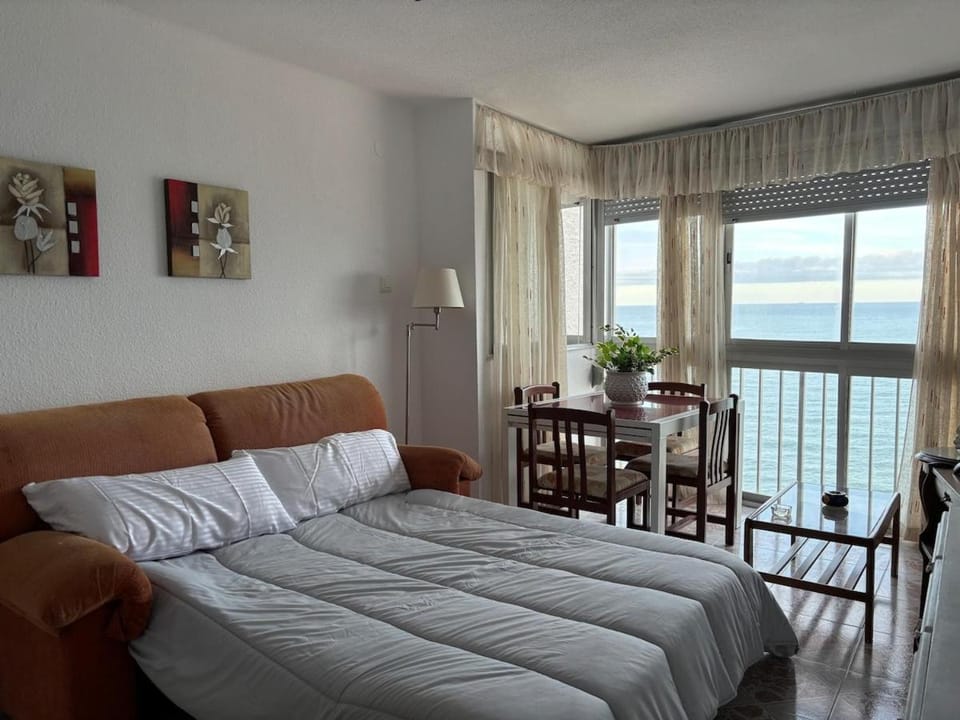 View (from property/room), Living room, Seating area, Dining area, Sea view