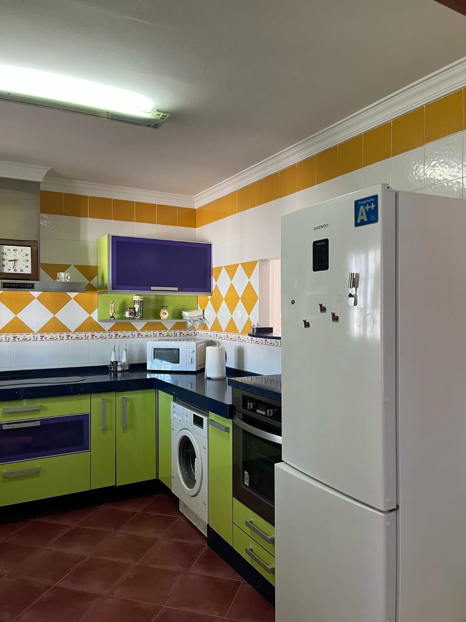 Kitchen or kitchenette, oven, stove, washing machine