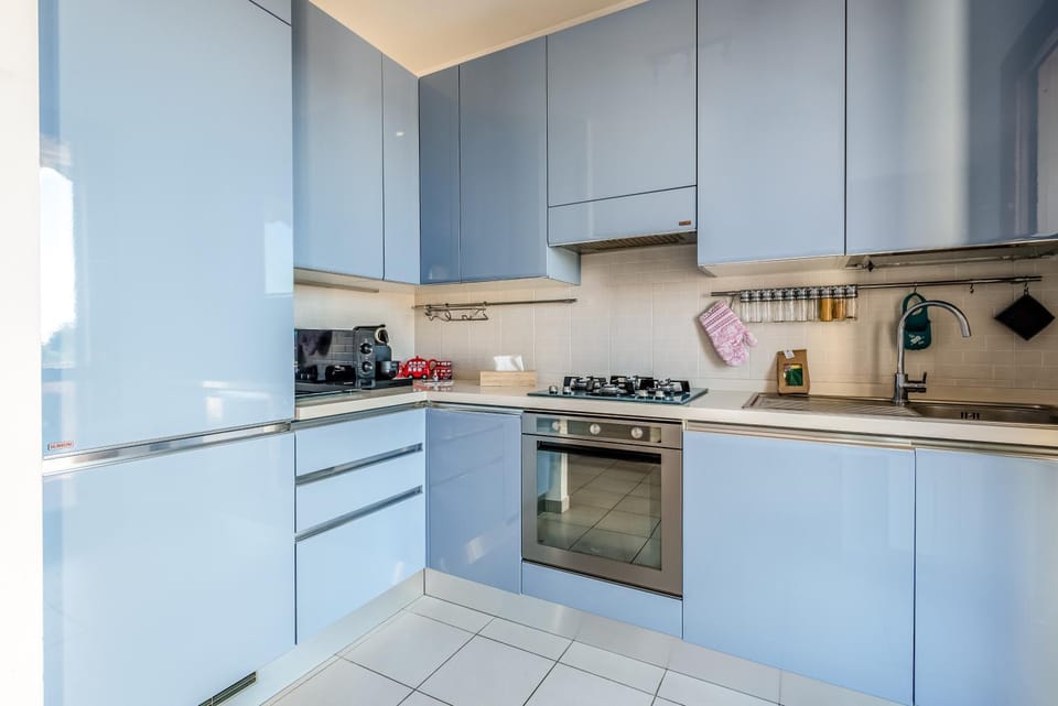 Kitchen or kitchenette, dishwasher, stove, toaster