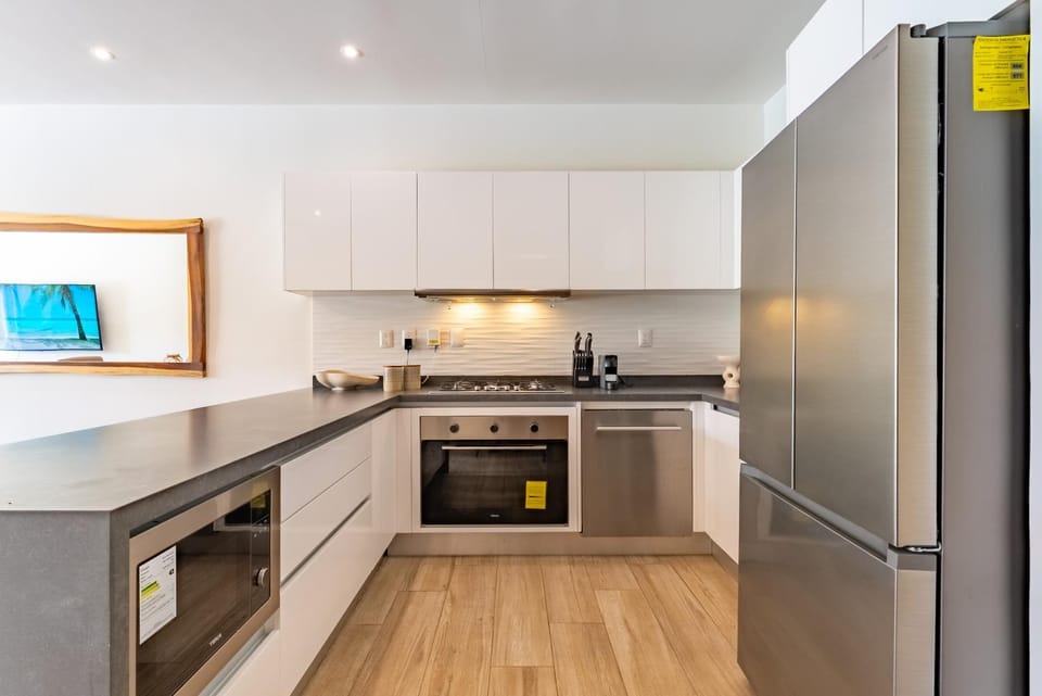 Kitchen or kitchenette, dishwasher, oven, stove