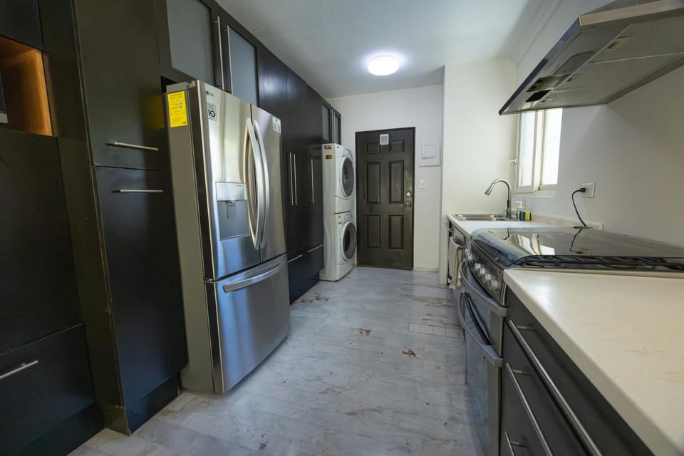 Kitchen or kitchenette, dishwasher, oven, stove