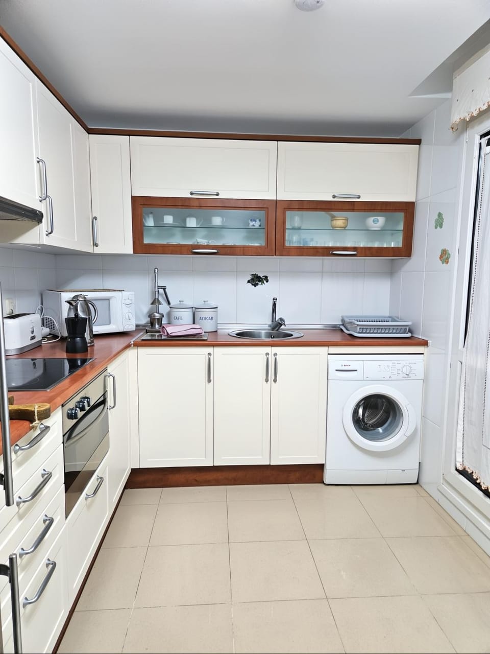 Kitchen or kitchenette, oven, stove, washing machine