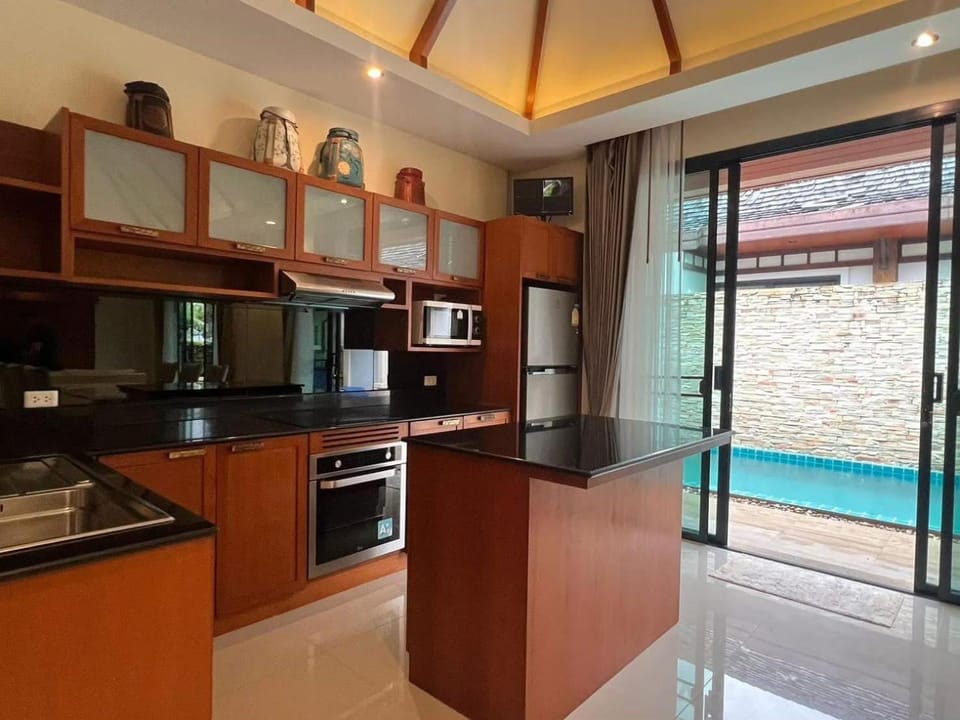 Kitchen or kitchenette, dishwasher, oven, stove