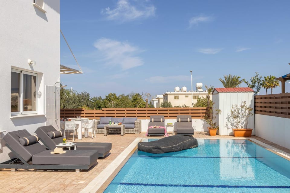 Property building, Patio, Day, Natural landscape, View (from property/room), Balcony/Terrace, Living room, Seating area, Pool view, Swimming pool, sunbed