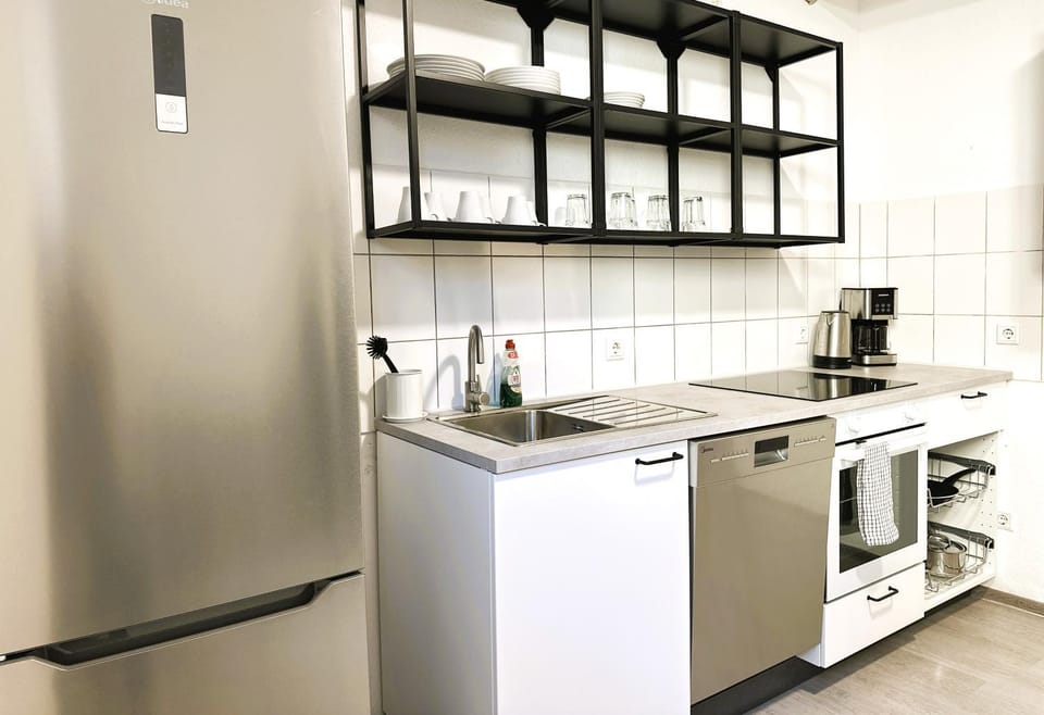 Kitchen or kitchenette, dishwasher, oven, stove