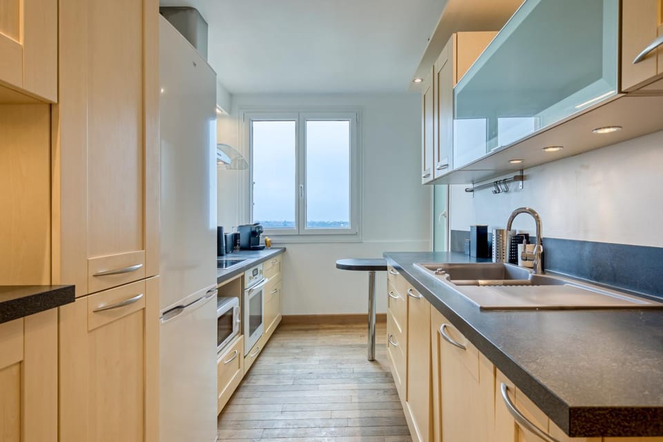 Kitchen or kitchenette, dishwasher, oven, stove