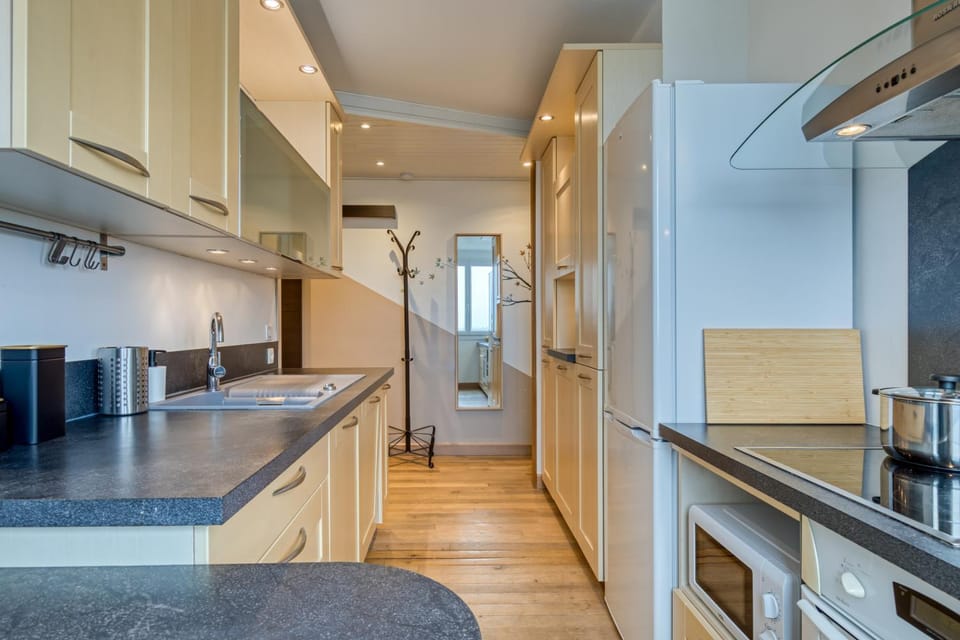 Kitchen or kitchenette, dishwasher, oven, stove