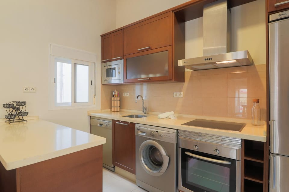 Kitchen or kitchenette, dishwasher, oven, stove, toaster, washing machine