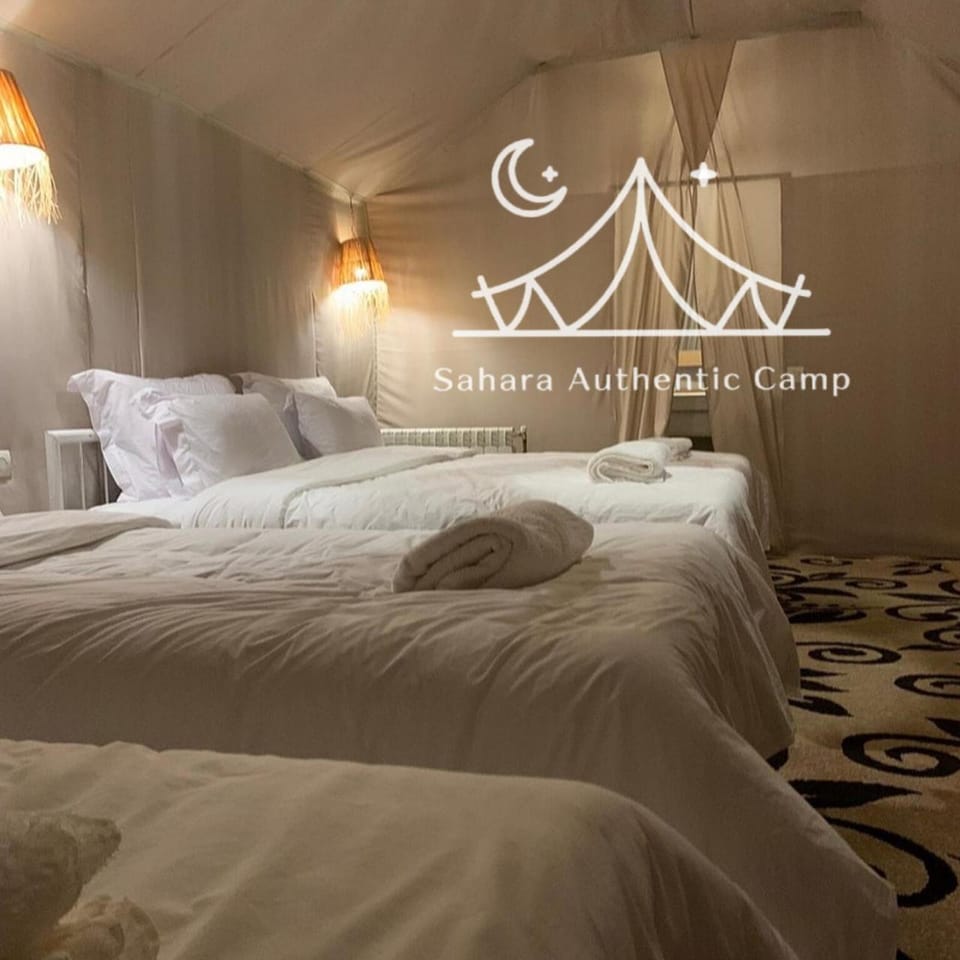 Bed, Photo of the whole room, Bedroom, Text overlay, towels