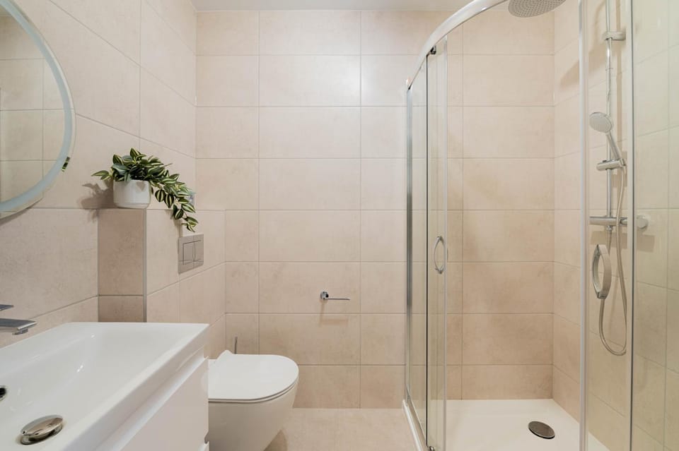 Shower, Toilet, Bathroom, flat iron, hair dryier, towels