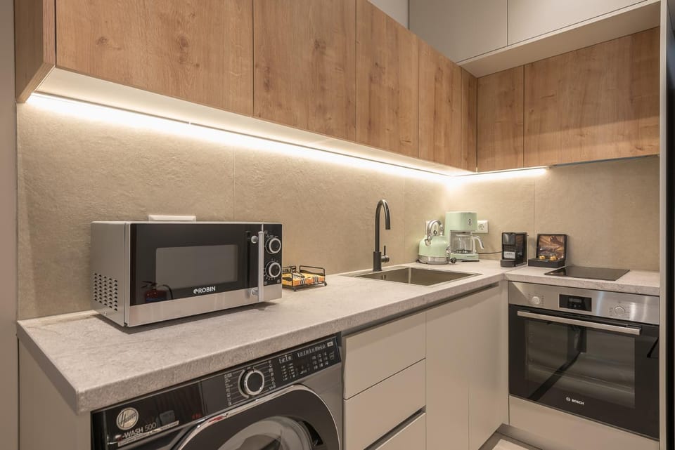 Kitchen or kitchenette, stove, toaster, washing machine