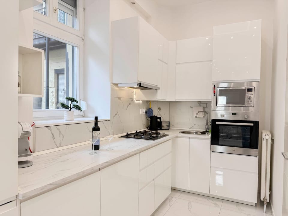 Kitchen or kitchenette, dishwasher, oven, stove, toaster, washing machine