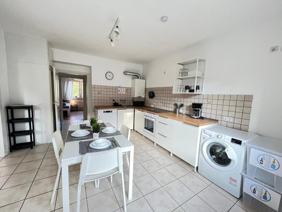 Kitchen or kitchenette, Dining area, dishwasher, stove, washing machine