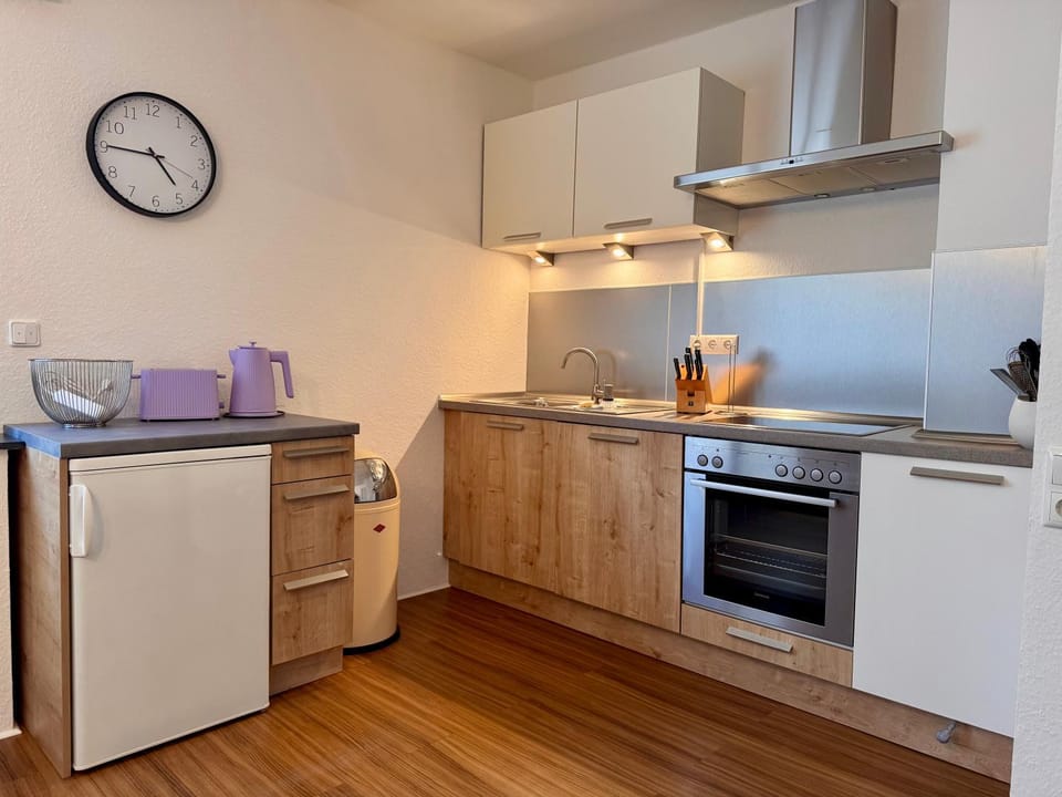 Kitchen or kitchenette, dishwasher, oven, stove, toaster