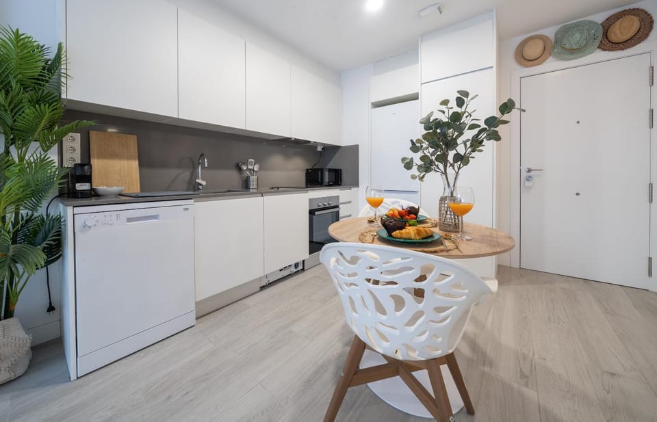 Kitchen or kitchenette, dishwasher, oven, stove