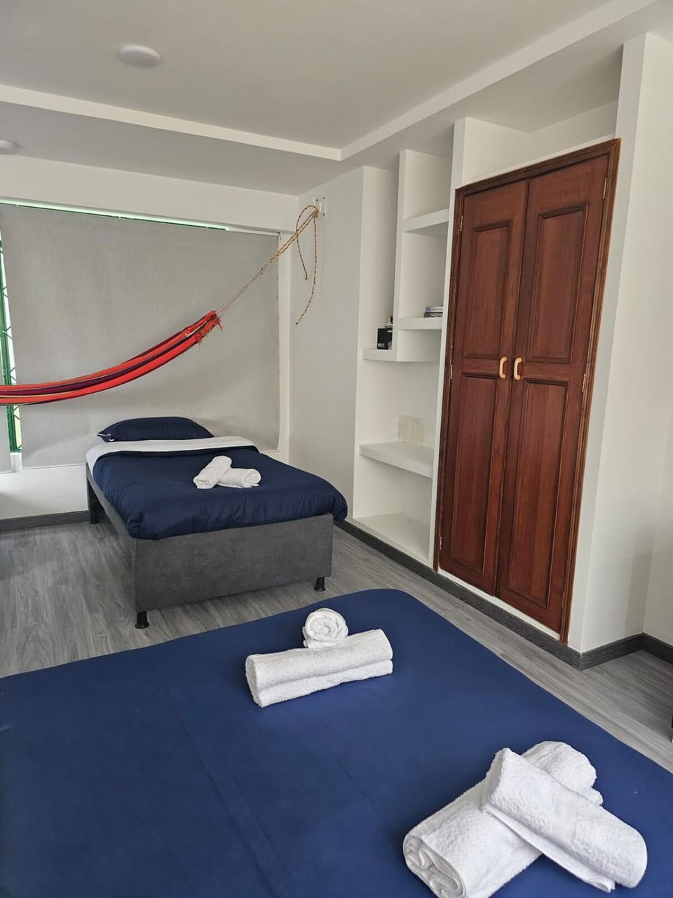 Bed, towels, wardrobe