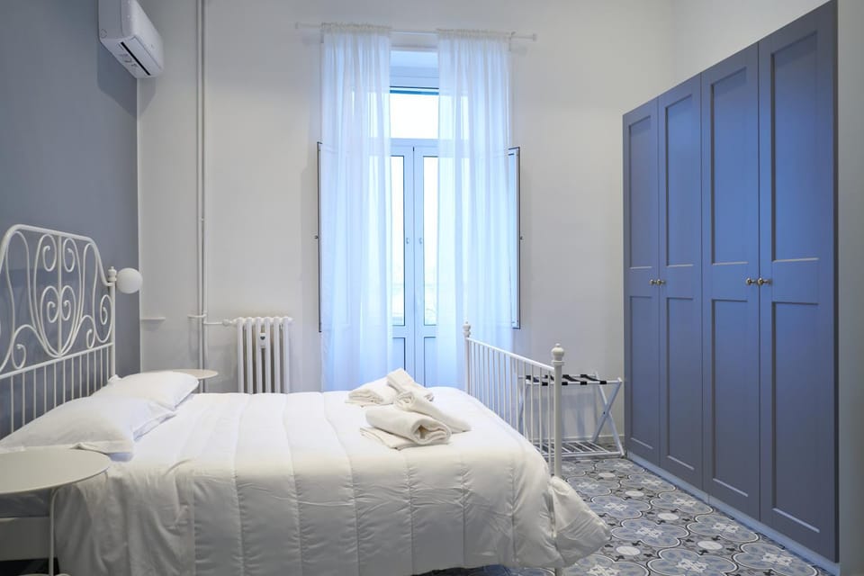Bed, Bedroom, towels, wardrobe, air conditioner