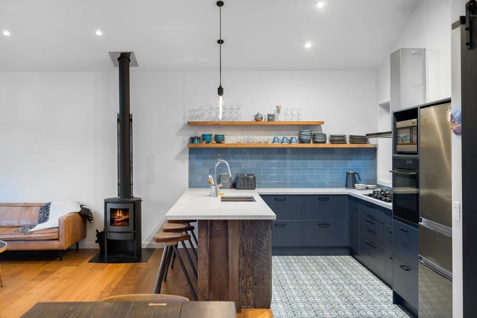 Kitchen or kitchenette, dishwasher, oven, stove