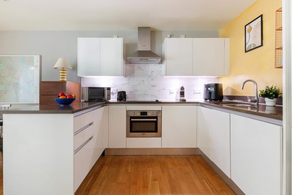 Kitchen or kitchenette, dishwasher, oven, stove