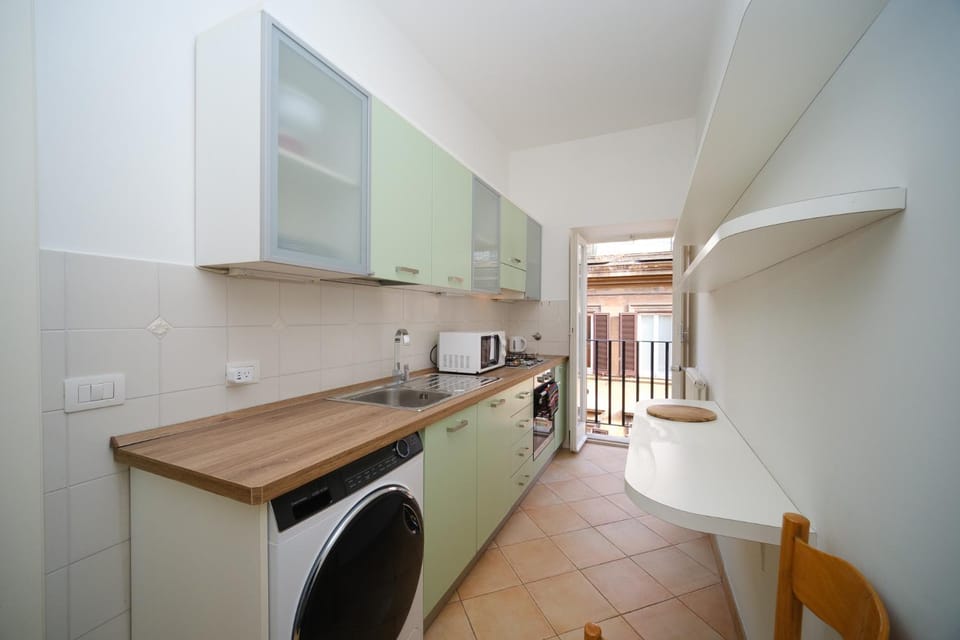 Kitchen or kitchenette, oven, stove, washing machine