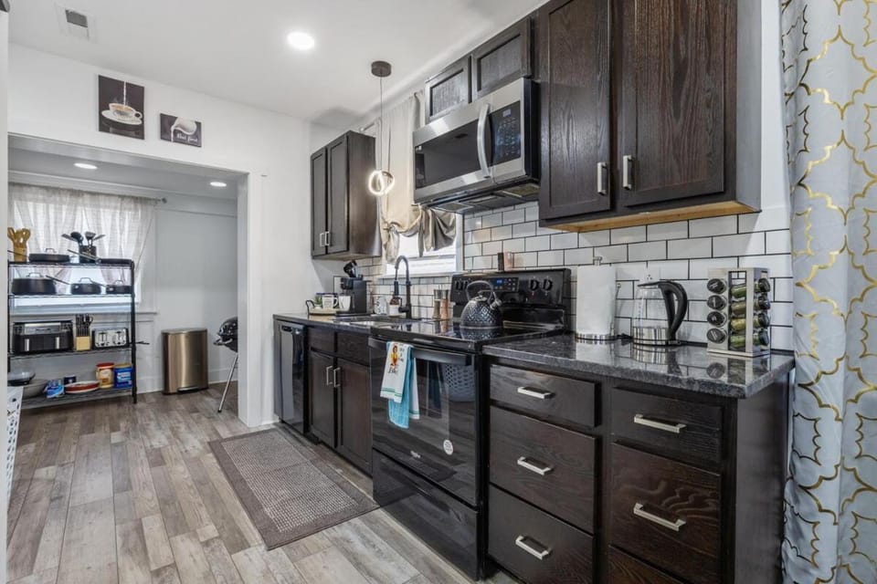 Kitchen or kitchenette, dishwasher, microwave, oven, stove