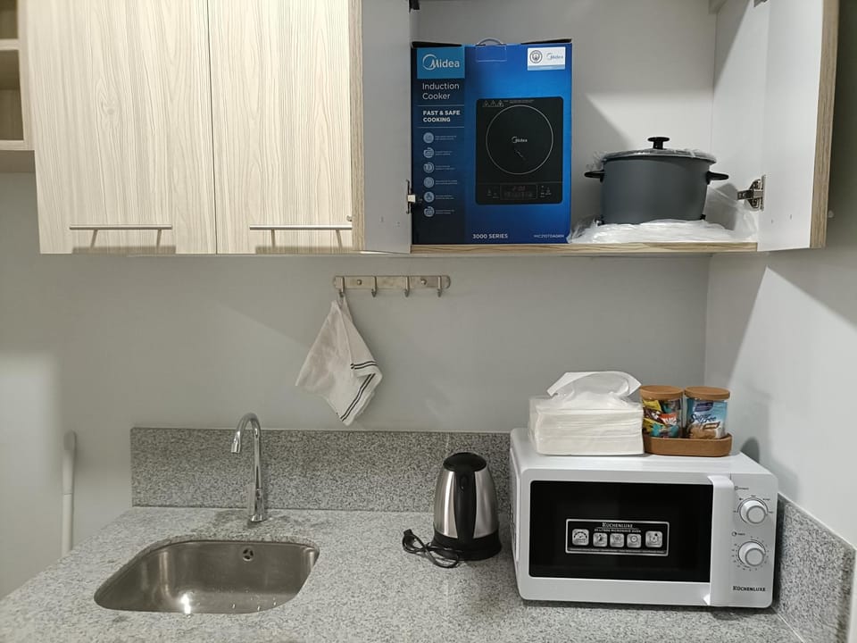 Kitchen or kitchenette, microwave