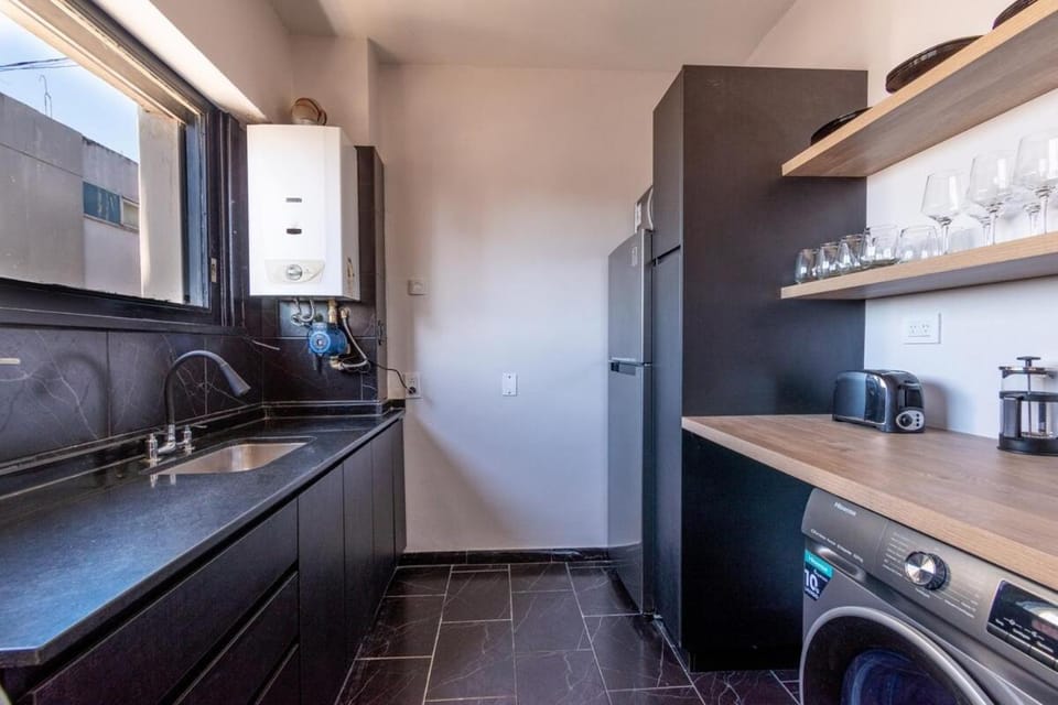 Kitchen or kitchenette, washing machine