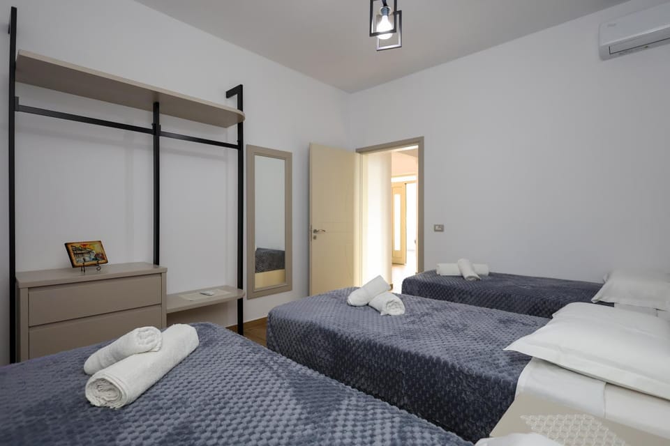 Bed, Photo of the whole room, Bedroom, towels, air conditioner