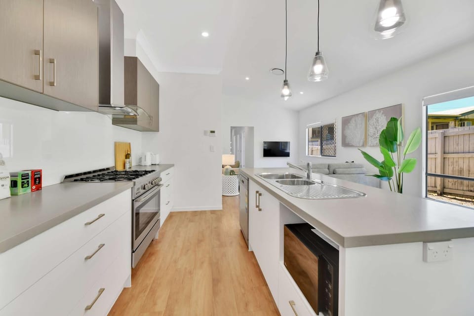 Kitchen or kitchenette, dishwasher, oven, stove