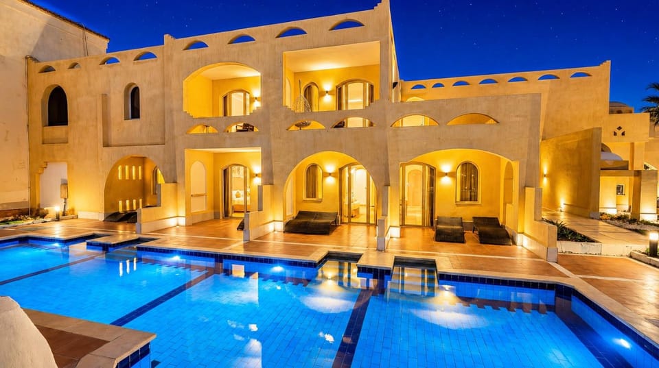 Property building, Patio, Night, Pool view, Swimming pool