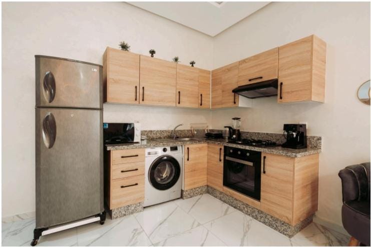 Kitchen or kitchenette, minibar, oven, stove, toaster, washing machine, dryer
