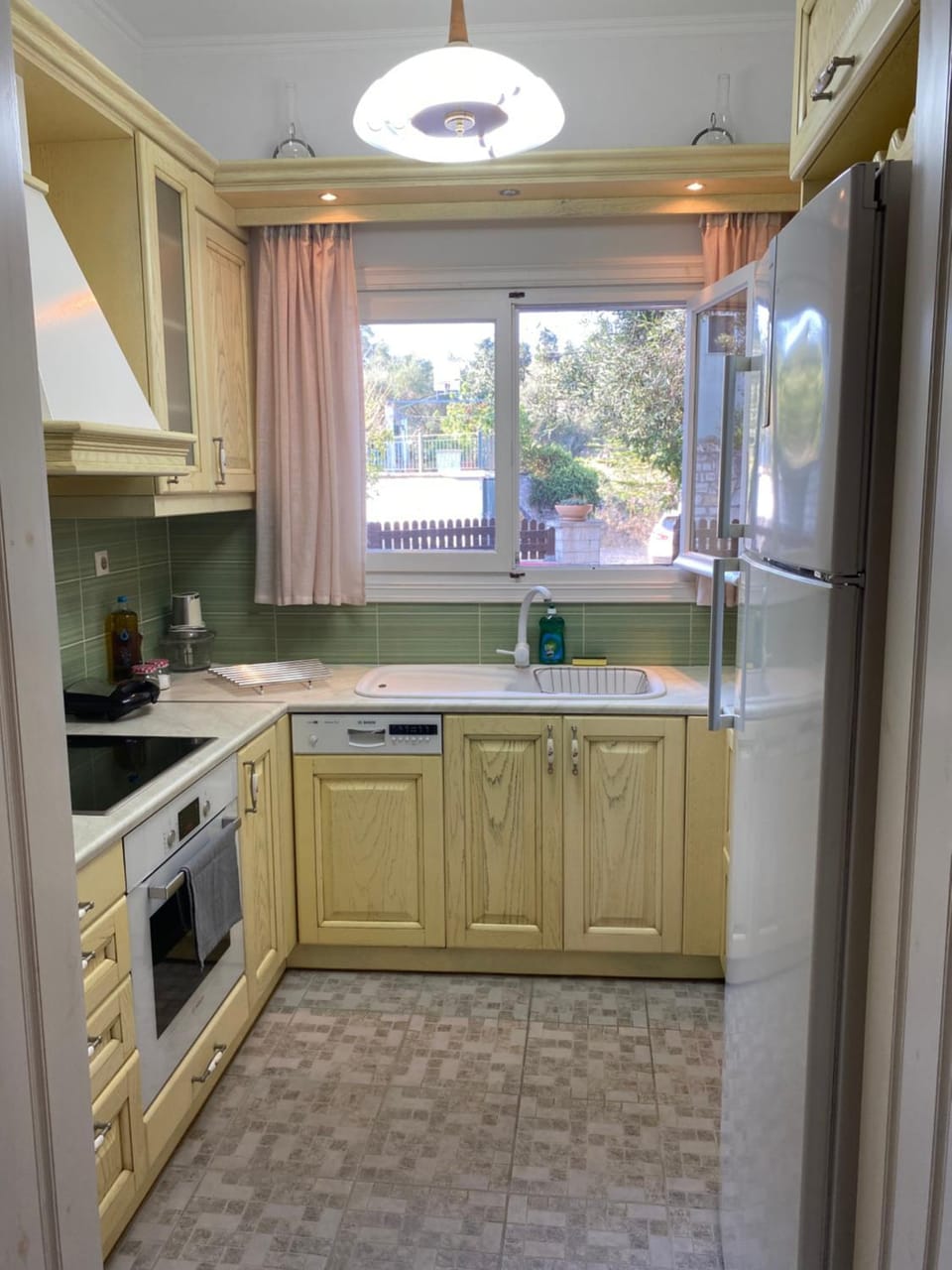Kitchen or kitchenette, dishwasher, oven, stove